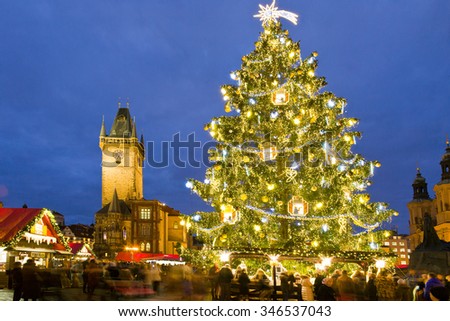 PRAGUE, CZECH REPUBLIC- DEC 02, 2015: Prague Christmas market on Old Town Square with gothic town hall tower. Centre of Prague is UNESCO protected.