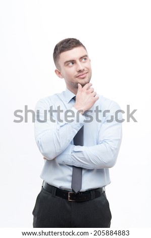 Junior handsome manager in necktie showing process of idea search, holding finger on chin isolated on white, concept pondering