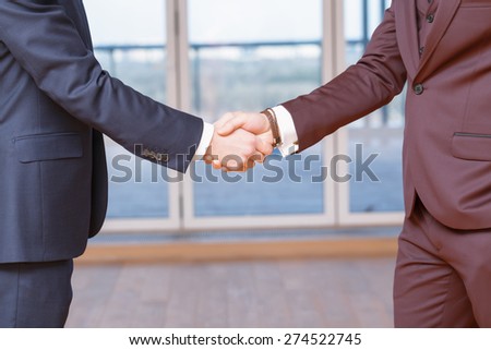 Handshake. Close-up handshake of businessmen having a good deal