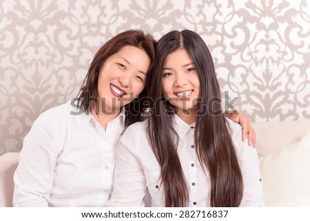 Family generation. Happy mother and daughter photo at home.