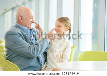 Grandfather meeting his cute granddaughter.