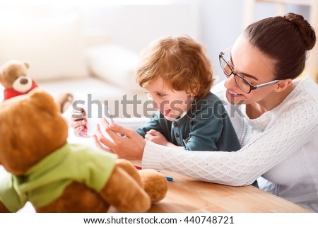 Mother and child playing on tablet