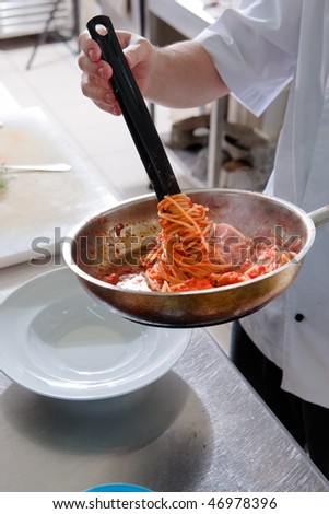 Chef brings in a plate seafood pasta