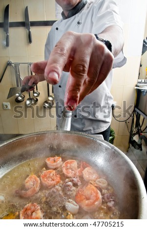 Chef prepare seafood mix for pasta