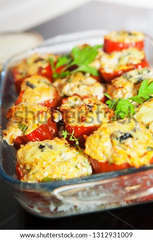 Stuffed pepper with chicken fillet, brown rice and vegetables and herbs. Dietary dish