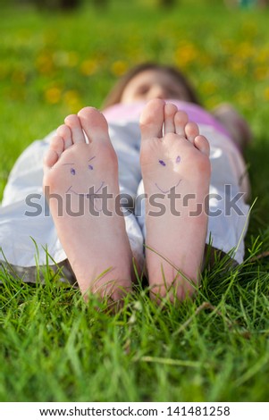 Children laying on grass. Family picnic in spring park