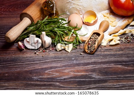 Ingredients For Homemade Pasta On Wooden Table On Brown Background