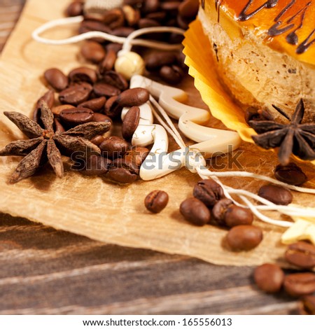 Coffee cakes with chocolate, spices and coffee seeds, close up