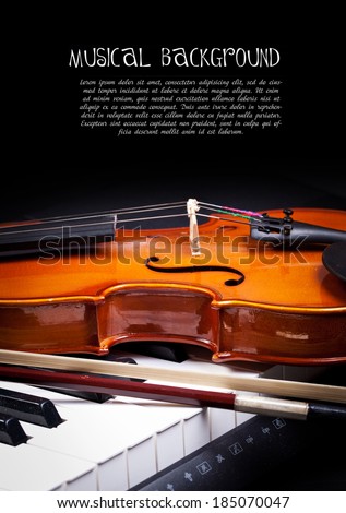 Violin and piano keys on black
