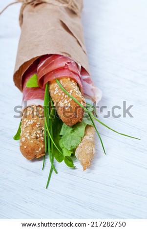 Parma ham prosciutto with grissini bread sticks
