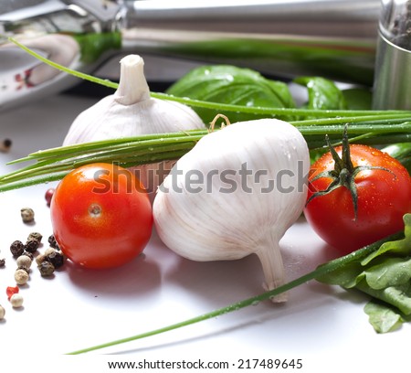 Blender with fresh vegetables and herbs
