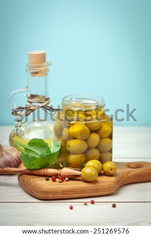 Green olives, basil, garlic and oil