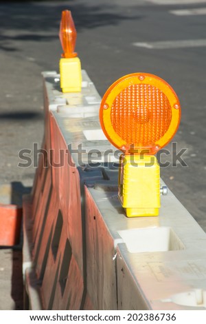 road work barriers and orange reflectors
