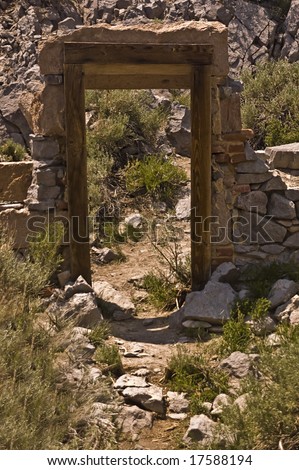A narrow door stands in ruins of the bank at Bodie, California, a ghost town and state park.