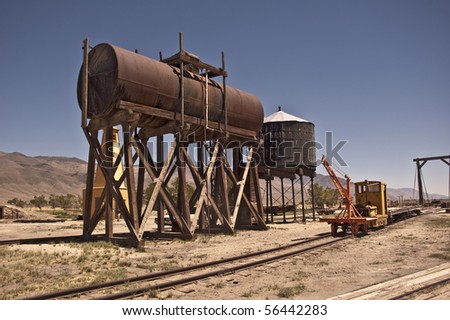 Vintage Water and Fuel Tanks along railway maintenance equipment and tracks at Laws Railroad Museum at Bishop, California