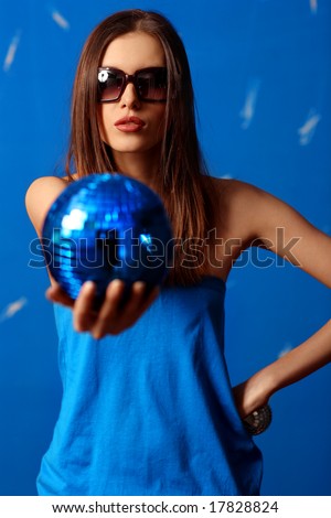woman with sphere. blue background