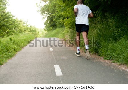 black man  running on the road