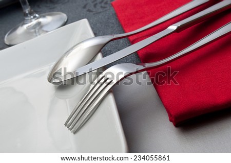 silverware closeup on red napkin