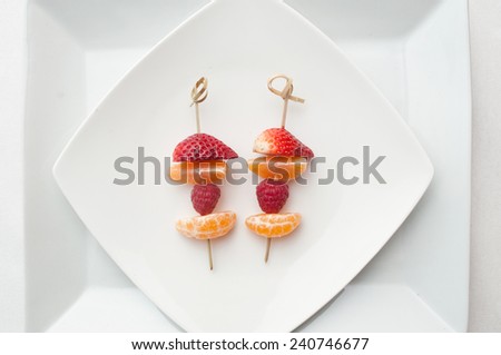 fruits skewer presentation in a plate