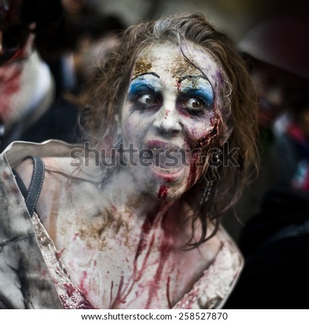 Paris, France - October 13  2012: People dressed as a zombie parades on a street during a zombie walk in Paris.