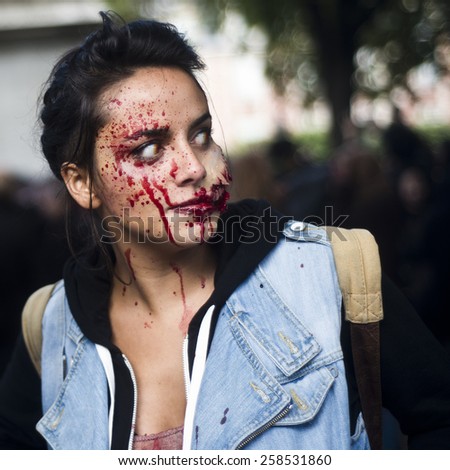 Paris, France - October 13  2012: People dressed as a zombie parades on a street during a zombie walk in Paris.