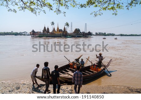 Thanlyin, Myanmar - February 20, 2014: Yele Paya, located mid river. Traveler have to Cross the muddy river about five minutes from coast.