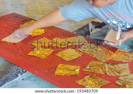 Thai culture, cover gold plate after lacquer for beautiful Thai art.