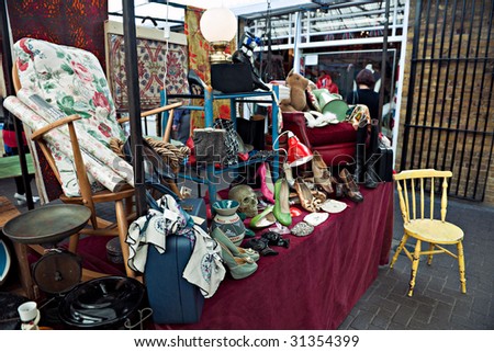 Assorted collectables or stage props for sale on a London street market stall
