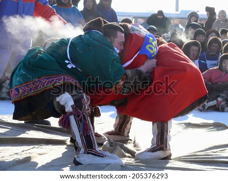 NADYM, RUSSIA - March 15, 2008: National Holiday - Day of the reindeer herders. The wrestling unknown men on holiday in Nadym, Russia - March 15, 2008.