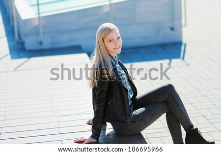 Cute happy girl model smiling in bright sunny day, street fashion