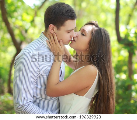 Young sensual couple in love, tender kiss