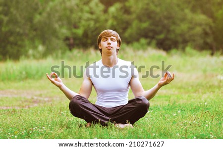 Yoga man relaxation outdoors