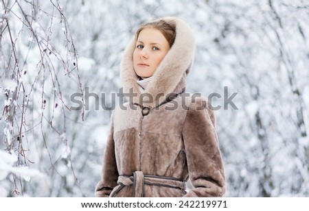 Winter and people concept - beautiful woman in winter weather