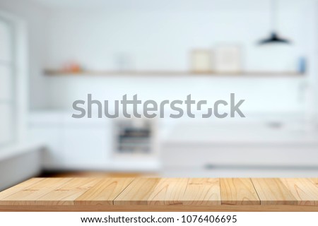 Empty wooden table top and  kitchen background. for food and product display montage