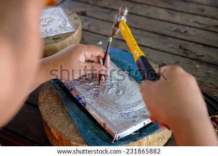 A man making silverware in chiangmai, Thai hand craft silverware