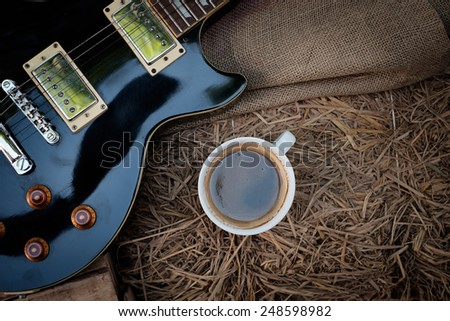Vintage Electric Guitar and Coffee on straw