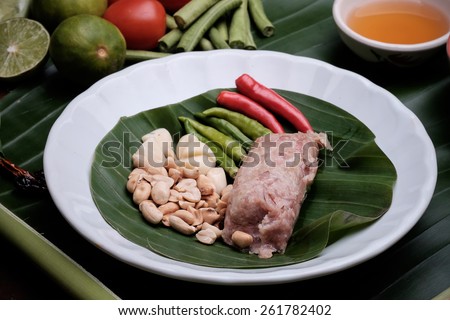 pork, shredded and salted, bound tighly with banana leaves, and eaten when slightly fermented