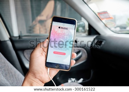 A man holding screen shot of Apple music app showing on iPhone 6 plus. Apple Music is the new iTunes-based music streaming service that arrived on iPhone,CHIANG MAI,THAILAND - JULY 26,2015