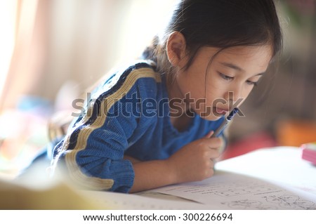 Asian young girl read a book