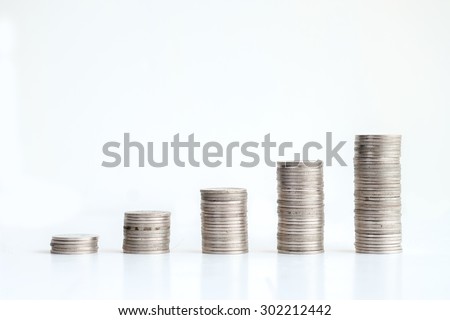 Coins stand vertically in columns ascending,revenue growth concept.