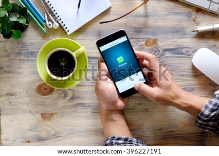 CHIANG MAI,THAILAND - MAR 26, 2016 : Man holding a iPhone 6 plus with social Internet service WhatsApp on the screen. iPhone 6 plus was created and developed by the Apple inc.