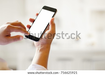 Man holding smart phone with blurred background. For Graphic display montage.