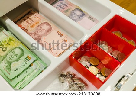 thai money in the cash drawer