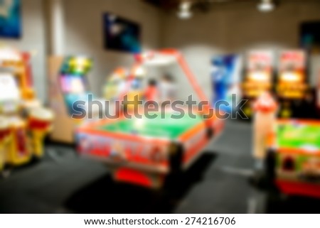 Blurred game shop in shopping mall ,defocus vintage tone