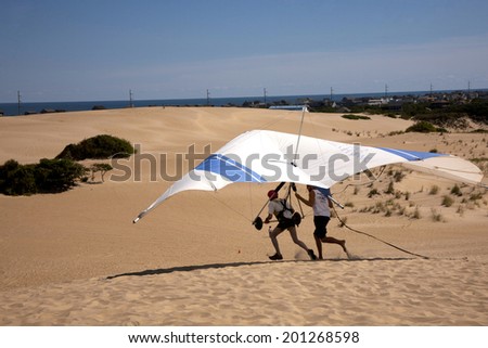Kitty Hawk, NC, USA - September 25, 2012 : Students learning to fly at the Hang Gliding School located in  the sand dunes of Jockey\'s RIdge State Park, Kitty Hawk,North Carolina