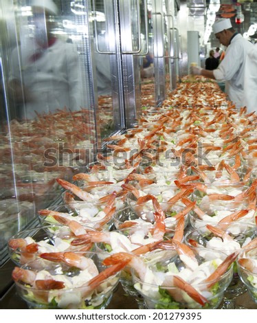 Westpoort, Netherlands - August 15, 2012 : Rows of shrimp cocktails being prepared for dinner service in a ships galley