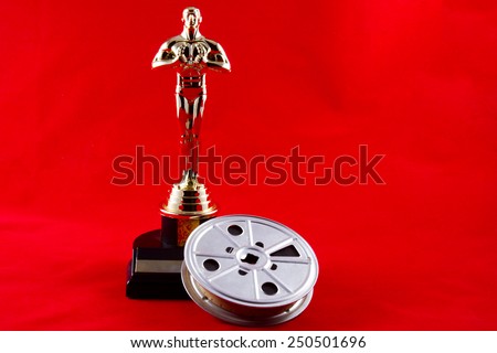New Cumberland, PA, USA - February 3, 2015 : Oscar statuette with movie reel on red carpet