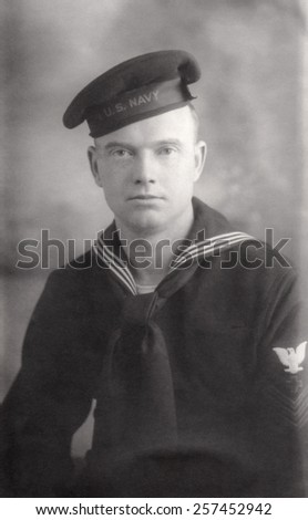 Young World War 2 Navy recruit in navy blues