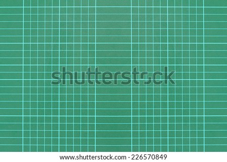 Green grid pattern background of cutting mat , Through the use
