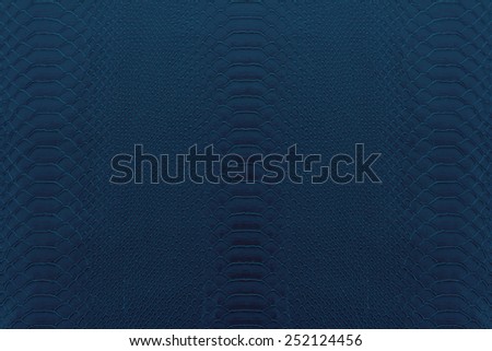 Texture background of navy blue reptile leather